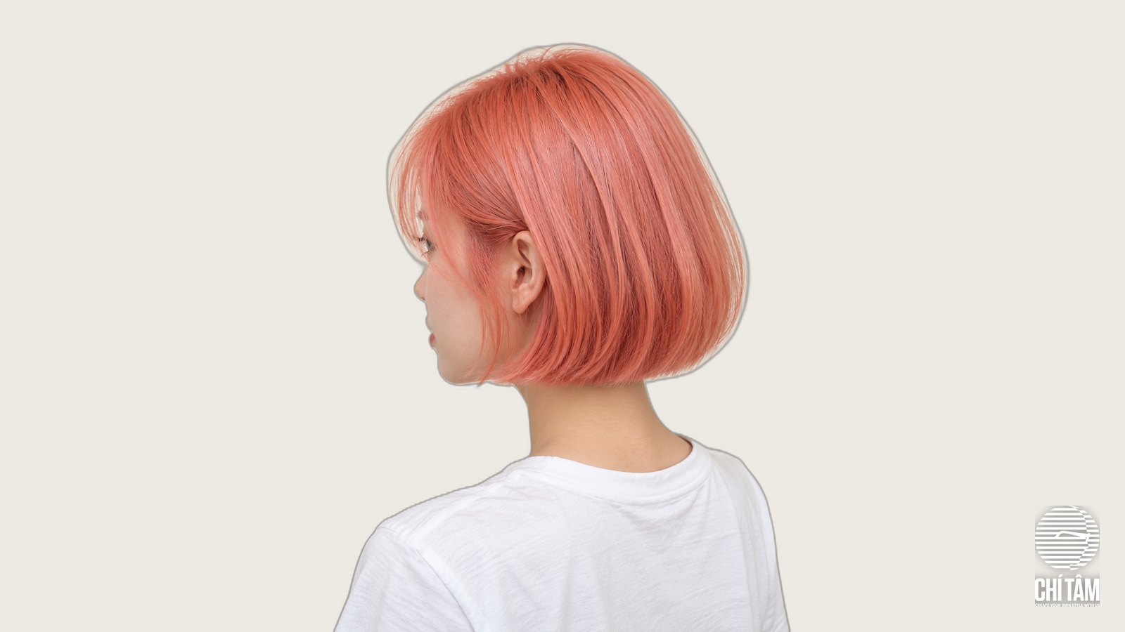 Tóc ngắn ngang cằm nhuộm hồng cam coral nhìn chéo sau - Chí Tâm Hair Salon